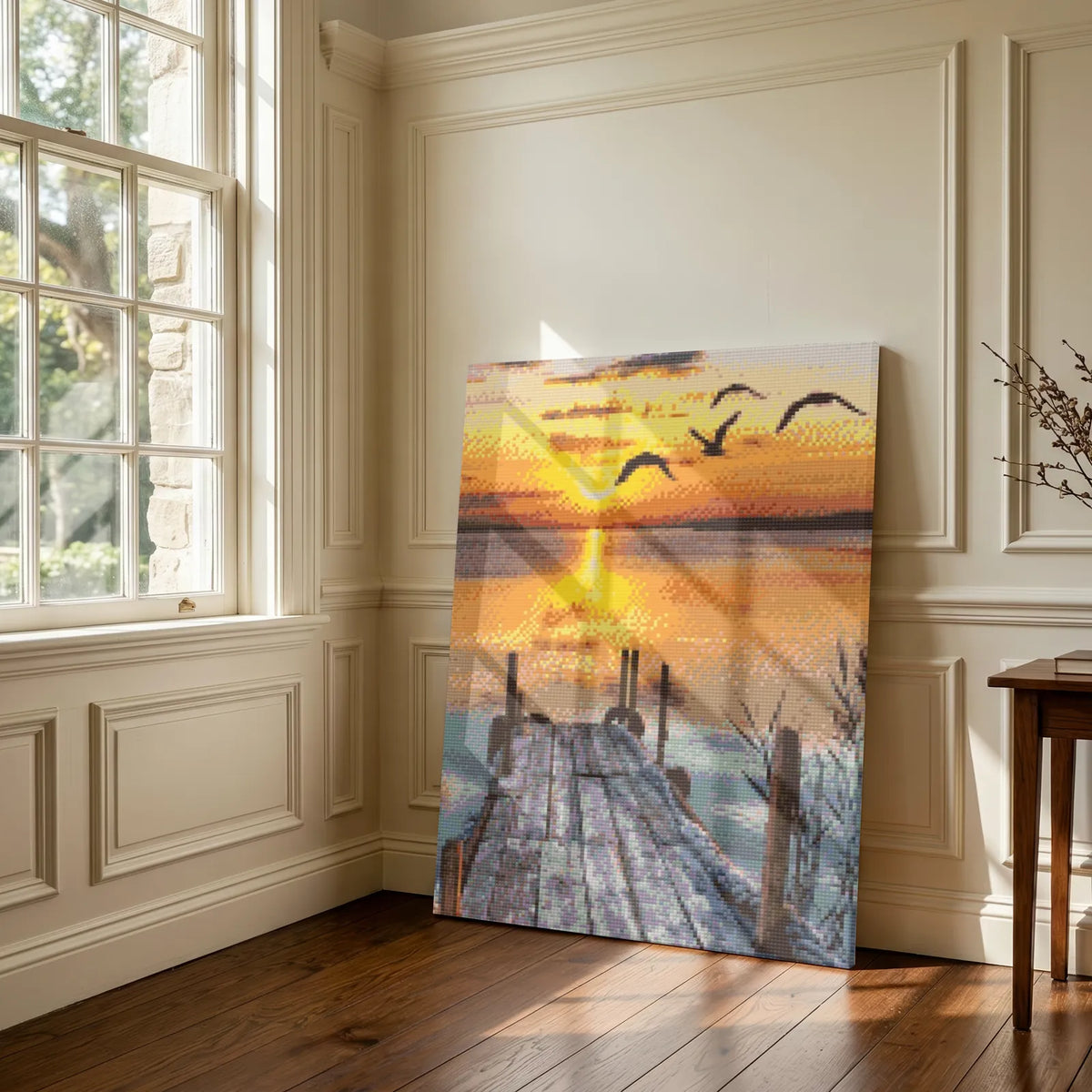 Snowy pier sunset diamond painting leaning in a panelled room by a sunlit window